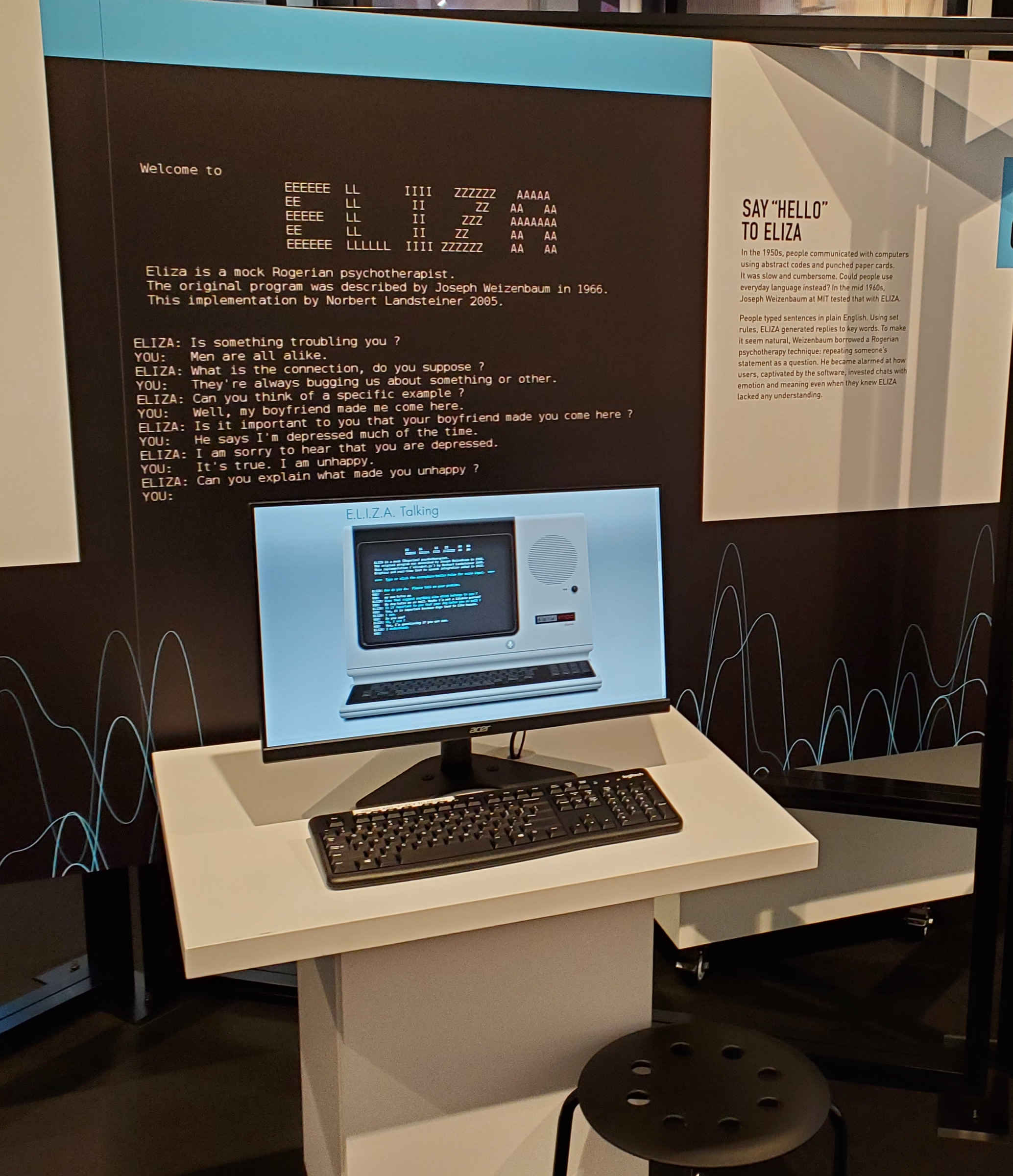 museum panel describing ELIZA with computer terminal